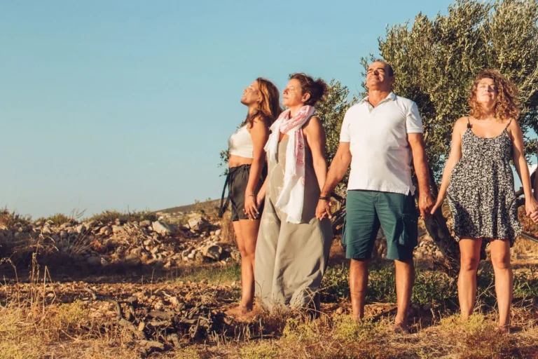 Four people enjoying the sun with closed eyes