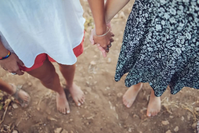 Two people holding hands